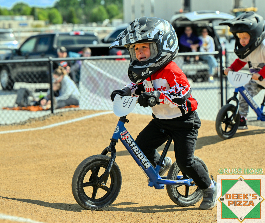 Young balance bike rider racing at Hugo's Raceway