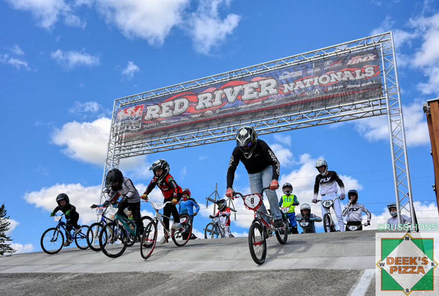 BMX riders dropping from the Red River Nationals start hill