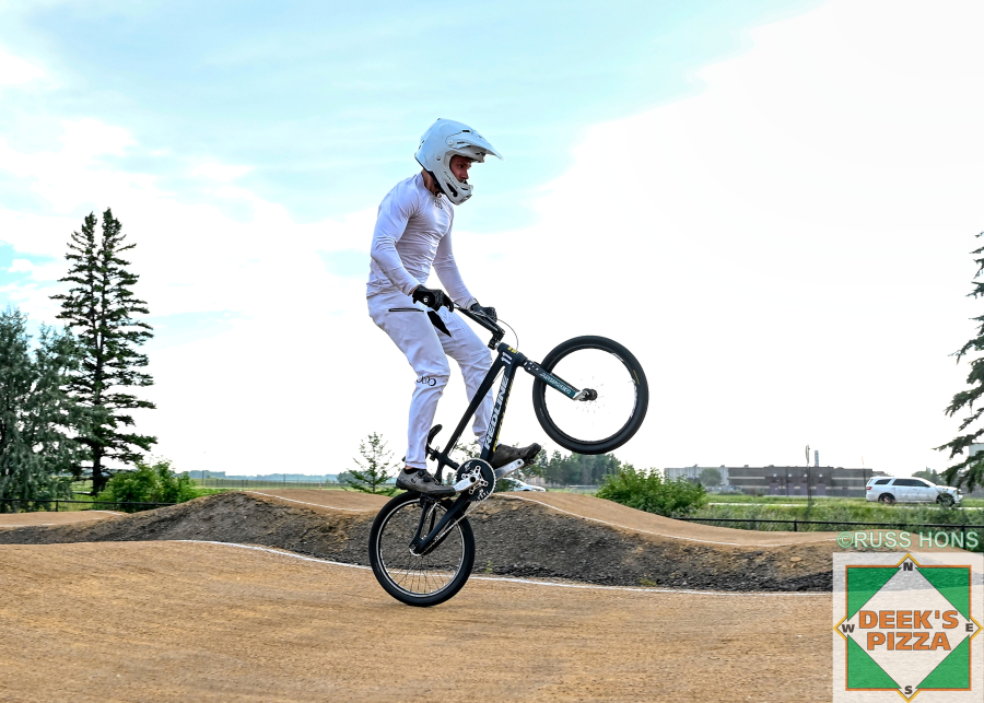 BMX rider performing a wheel lift at Hugo's Raceway